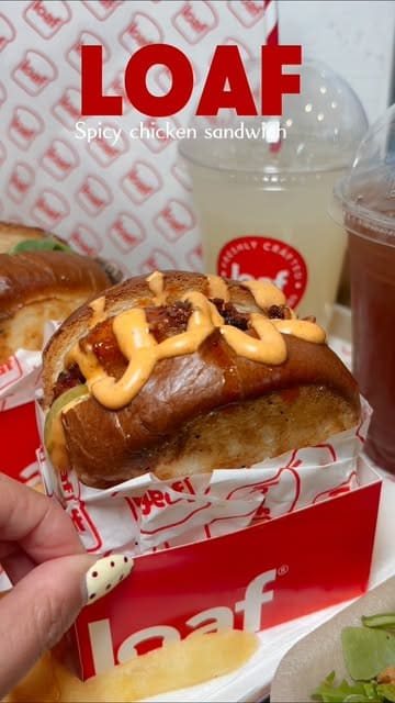 A short promotional video showcasing sandwiches and drinks from Loaf, featuring close-ups of the food and a brief appearance by the creator.