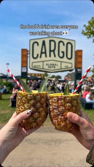 The video is a montage of clips from the 'CARGO Global Eats' area at the Badminton Horse Trials. It showcases various food and drink options, including burgers, steak sandwiches, cocktails in pineapples, and churros, alongside the seating area and the event atmosphere.
