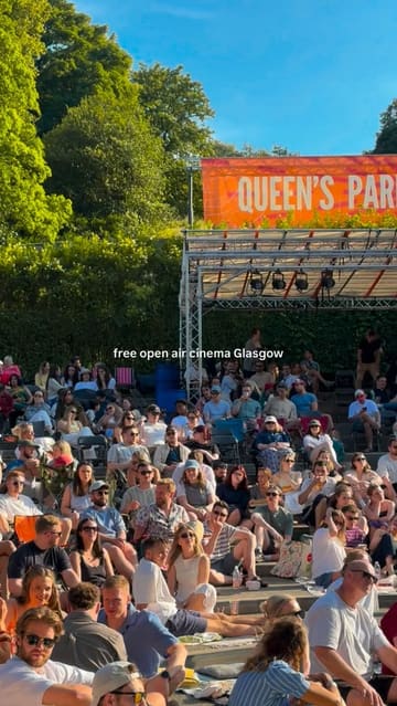 The video showcases an open-air cinema experience at Queen's Park Arena in Glasgow. It features shots of the audience, the venue setup including a disco ball, and food and drink options like pizza and cocktails, highlighting the relaxed and social atmosphere of the event.