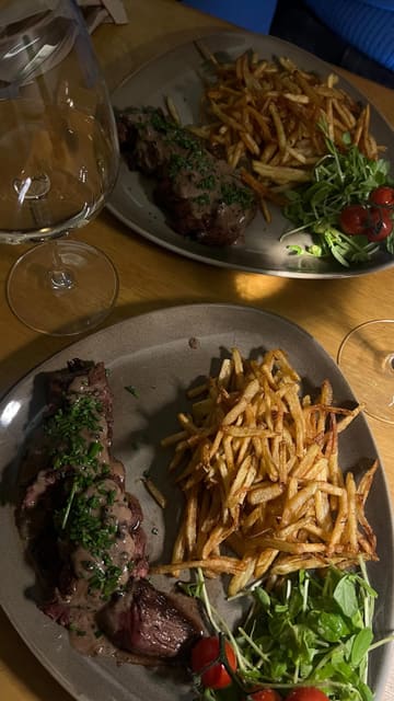 A video review of Le Haricot in Sheffield, featuring a creator sharing their experience of the steak frites and cheese board, highlighting the authentic French bistro vibe.