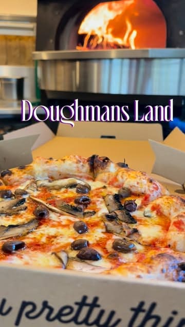 A short, engaging review of a street food pizza trailer in Glasgow. The creator showcases the wood-fired cooking process, the menu, and enjoys the pizza in a nearby park, effectively communicating the quality and casual vibe of the venue.