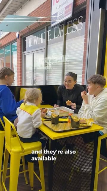 A creator visits Side Street in Bonnyrigg with her family, reviewing their box meal, smash burgers, and Texas toast. The video highlights the casual, takeaway-focused nature of the venue while providing a personal recommendation for locals.