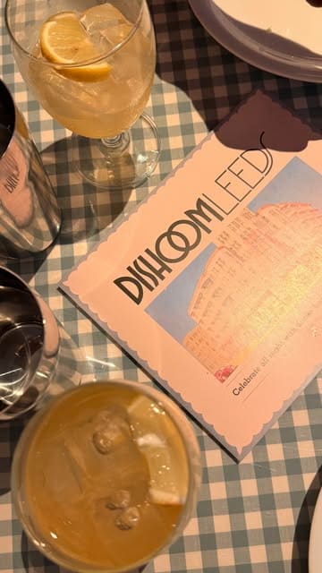 A promotional reel showcasing the interior, food, and drink offerings of the newly opened Dishoom in Leeds. The video features quick cuts of the restaurant's decor, cocktail preparation, kitchen staff, and various dishes.