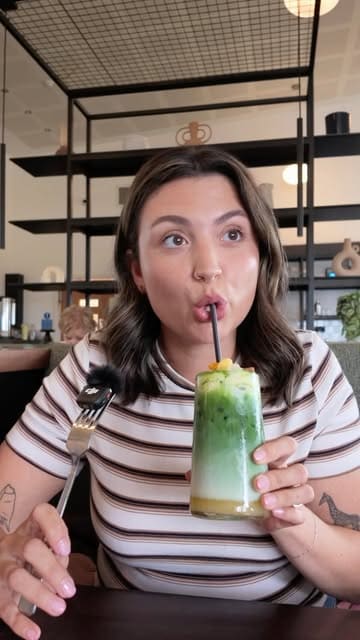 A couple visits a garden centre cafe for lunch, reviewing their drinks and food, followed by a brief tour of the garden centre's retail space.