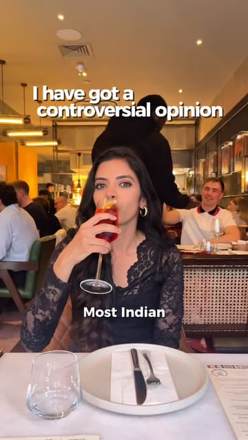The creator visits Pahli Hill Bandra Bhai in Central London, providing a review of their experience. The video features a mix of talking-head segments, close-ups of various Indian dishes like lamb chops, dosa, and crab sukkha, and shots of the restaurant's interior. The creator offers specific recommendations and critiques, maintaining a conversational and informative tone throughout.