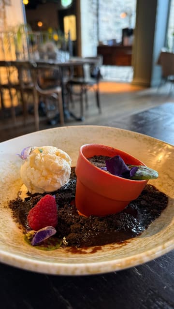A montage video showcasing a Sunday roast experience at The Botanist, featuring close-ups of roast chicken, pork belly, various sides, cocktails, and the venue's botanical-themed interior.