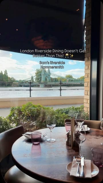 A montage-style video showcasing Sam's Riverside in Hammersmith, featuring shots of the exterior, interior, river views, and various dishes including burrata, octopus, steak, burger, and desserts.
