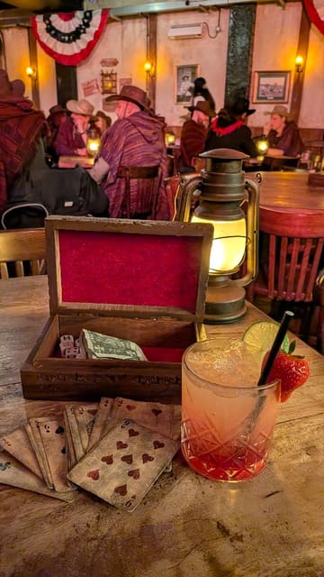 The video provides a glimpse into the Moonshine Saloon, an immersive, speakeasy-style bar experience. It features shots of the themed interior, staff in costume, and the cocktails served, highlighting the interactive nature of the venue.
