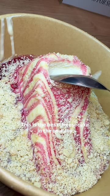 A short, punchy review of The Baker Boy in Heckmondwike, focusing on their signature San Sebastian cheesecakes and viral Matilda cakes. The video uses close-up shots to demonstrate the texture and creaminess of the desserts, accompanied by a voiceover and text overlays.