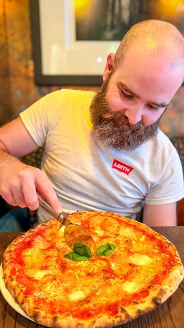 A review of 3 Blind Mice pizza restaurant and The Burrow cocktail bar in Edinburgh. The video features two creators trying various pizzas, desserts, and cocktails, highlighting the quality of the food and the cozy, intimate atmosphere of both the restaurant and the downstairs bar.