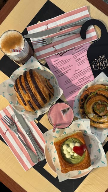 A visually appealing reel showcasing a brunch collaboration between Cafe Ciel and Buns From Home, featuring aesthetic shots of various pastries, cloud-themed eggs, and coffee drinks.