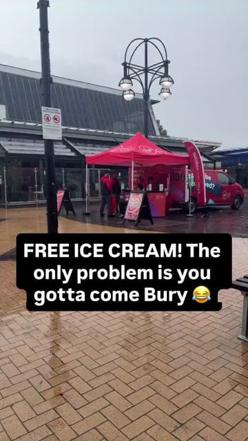 A creator visits a Virgin Media pop-up stand in Bury to get free ice cream, engaging in a brief, informal conversation with the staff about the promotion.