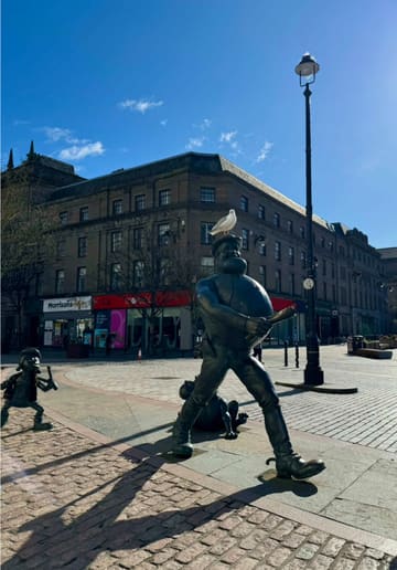 A short, aesthetic montage showcasing a sunny day in Dundee, featuring visits to local cafes including The Bach and Höfn, with shots of coffee and a waffle.
