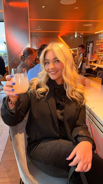 A creator visits the rooftop bar at the Johnnie Walker Experience in Edinburgh, highlighting the panoramic city views, the unique passport-themed cocktail menu, and the overall atmosphere.