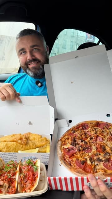 A creator reviews a variety of food items from a local chippy, including tacos, pizza, fish and chips, a chicken burger, cookies, a milkshake, and a brownie, highlighting the venue's expanded menu.
