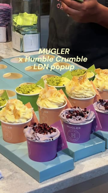 A promotional video for a Mugler x Humble Crumble popup event at Old Spitalfields Market, featuring a tasting flight of mini crumbles inspired by perfume scents.
