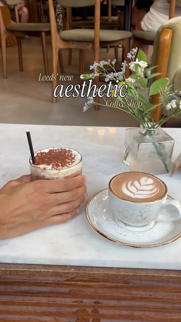 A short, aesthetic montage showcasing the interior and drink offerings of a new coffee shop called Moods in Leeds, located in the First White Cloth Hall.