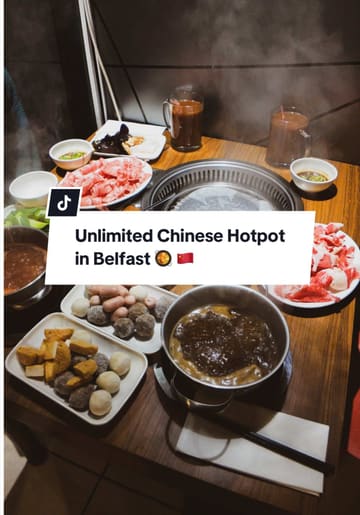 The video is a review of a hotpot restaurant in Belfast, showcasing the buffet-style dining experience. The creator walks viewers through the process of choosing a soup base, selecting ingredients from the buffet, creating a custom sauce, and cooking the food at the table.