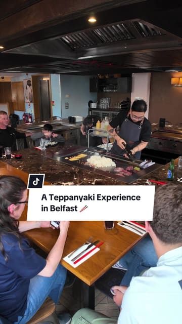 A first-person review of Teppan 3 in Belfast, showcasing the interactive teppanyaki dining experience, including chef performances, knife tricks, and a variety of dishes like mussels, scallops, soft shell crab, and sushi.