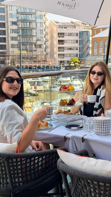 A short, aesthetic montage showcasing an afternoon tea service at The Anchor, Chelsea Harbour. The video features slow, deliberate shots of the terrace setting overlooking the harbour, the tiered afternoon tea stand, close-ups of sandwiches, scones, and delicate pastries, and the pouring of tea.