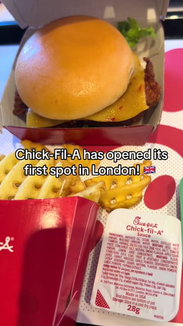 A short, handheld-style video documenting the opening of the first Chick-fil-A location in London. The video captures the exterior queue, the interior atmosphere, and a close-up of the food, providing a quick, informative update for viewers interested in the new venue.