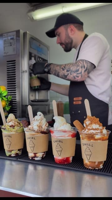 A promotional video for a new ice cream stall called Swirl, located at Aberdeen Beach. The video showcases the menu board and the preparation of various soft-serve sundaes, including flavours like Matcha, Dubai Chocolate, Kinder Bueno, Strawberry Shortcake, and Lotus Biscoff, finishing with shots of the finished products by the sea.