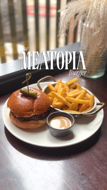 A promotional video for Gōst in Glasgow, focusing on their Thor's Hammer & Haggis Bun burger. The video features high-quality close-up shots of the food, including the burger, fries, and drinks, set to music with text overlays providing details about the dish and location.