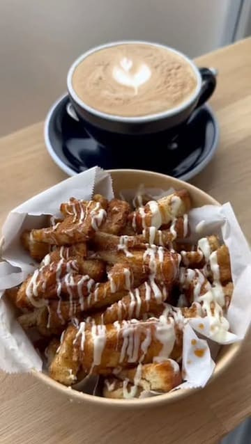 A short, montage-style video showcasing Seventeen Coffee in North Shields, featuring close-ups of a flat white, honey cinnamon bites, and the shop's menu and interior.