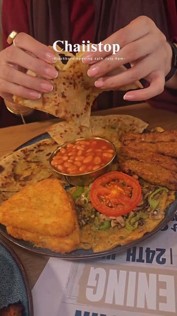 A promotional video for the opening of a new Chaii Stop branch in Blackburn, featuring a montage of their grill menu, breakfast items, and desserts, alongside shots of the venue interior.