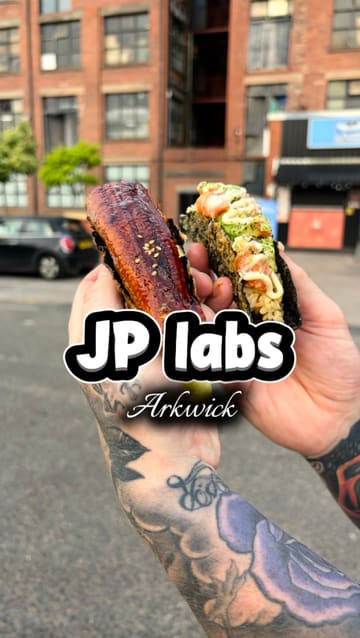 The creator reviews Japanese street food from JP Lab in Ardwick, showcasing dishes like unagi rice bowls and sushi tacos while eating them in a car park.
