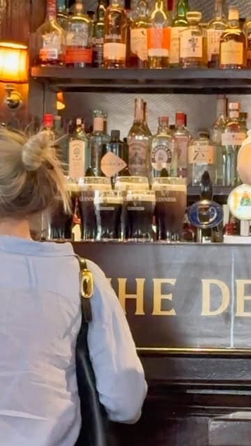 A couple documents their 'foodie trip' across London, visiting various bakeries, a pub, and a pizza spot. The video features quick cuts of them trying different pastries, oysters, and drinks, providing a fast-paced tour of their culinary day out.