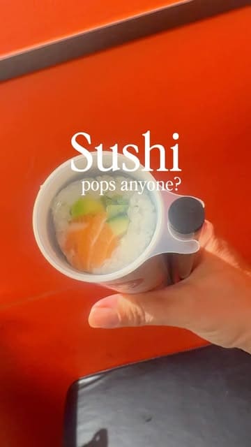 A short, punchy video demonstrating the Sushi Pops concept, showing the process of opening, saucing, and eating sushi served in a tube. The video highlights the novelty of the packaging and the freshness of the ingredients.