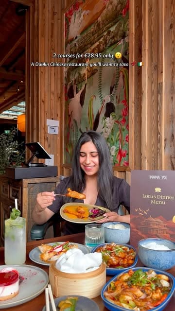 A promotional video for Mama Yo in Dublin, showcasing their 'Lotus Dinner Menu' offer. The video features shots of the restaurant's interior, close-ups of various dishes including spring rolls, chicken skewers, prawns, and cheesecake, and includes the creator presenting the meal.