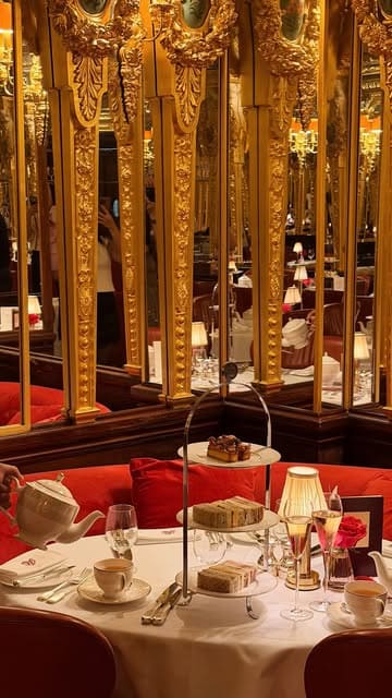 A visually polished montage showcasing the opulent interiors and literary-themed afternoon tea experience at Hotel Café Royal in London, featuring close-ups of pastries, sandwiches, and the grand dining room.