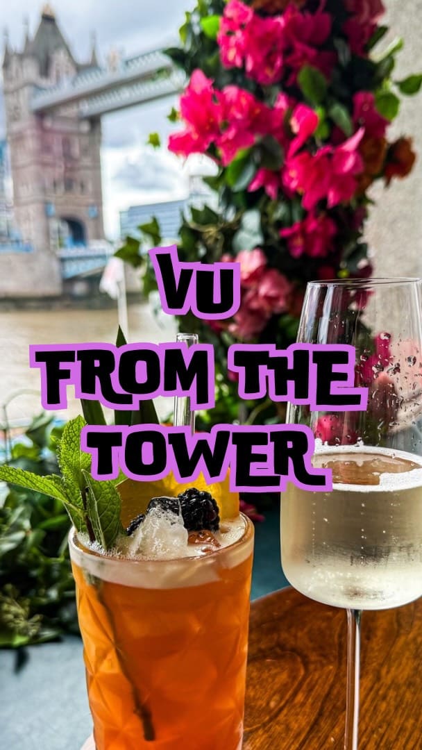 A promotional video for a bottomless brunch at 'Vu from the Tower', a restaurant with prominent views of London's Tower Bridge. The video showcases various brunch dishes, including Smoked Salmon with Scrambled Eggs, Eggs Benedict, Fish & Chips, and the Vu Burger. It also features a range of beautifully presented cocktails, such as an espresso martini and a strawberry daiquiri, alongside prosecco. The main focus is on the combination of the upscale food and drink offerings with the unique, picturesque setting.