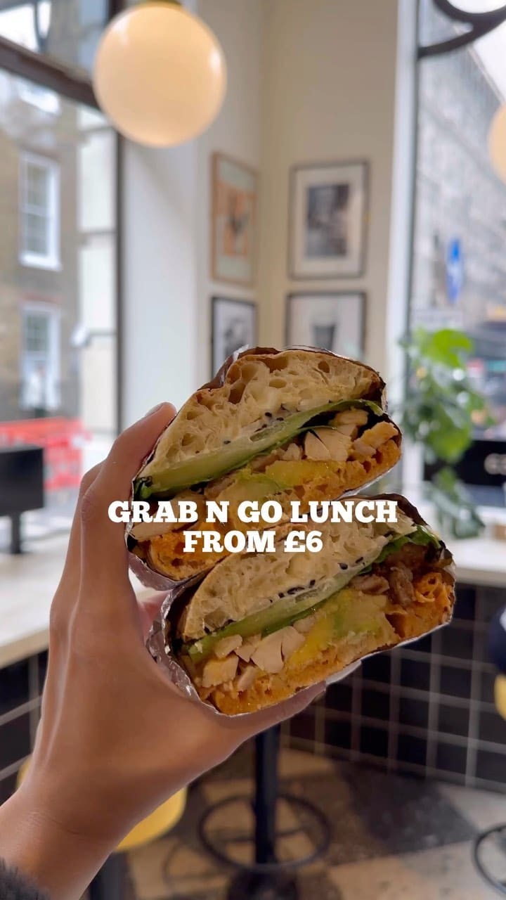 The video showcases Yolk London, a grab-and-go eatery in London. It features various menu items including sandwiches (chicken and avocado, mushroom melt), salads (mozzarella and tomato), and coffee. The food is presented in an appetizing manner, emphasizing freshness and abundance.  The video highlights the affordability and speed of service.