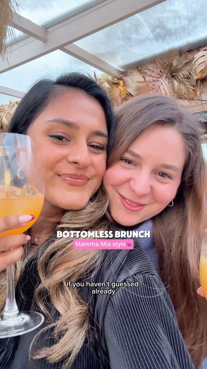 This video showcases a bottomless brunch experience at Circe's Rooftop Bar in Waterloo, London. The video features two women enjoying cocktails and the atmosphere of the bar. The food shown includes flatbreads topped with vegetables and fries, and lemon cake. The presentation of the food and drinks is casual and inviting. The main focus is on the bottomless brunch experience, including the drinks, food, and live ABBA music.