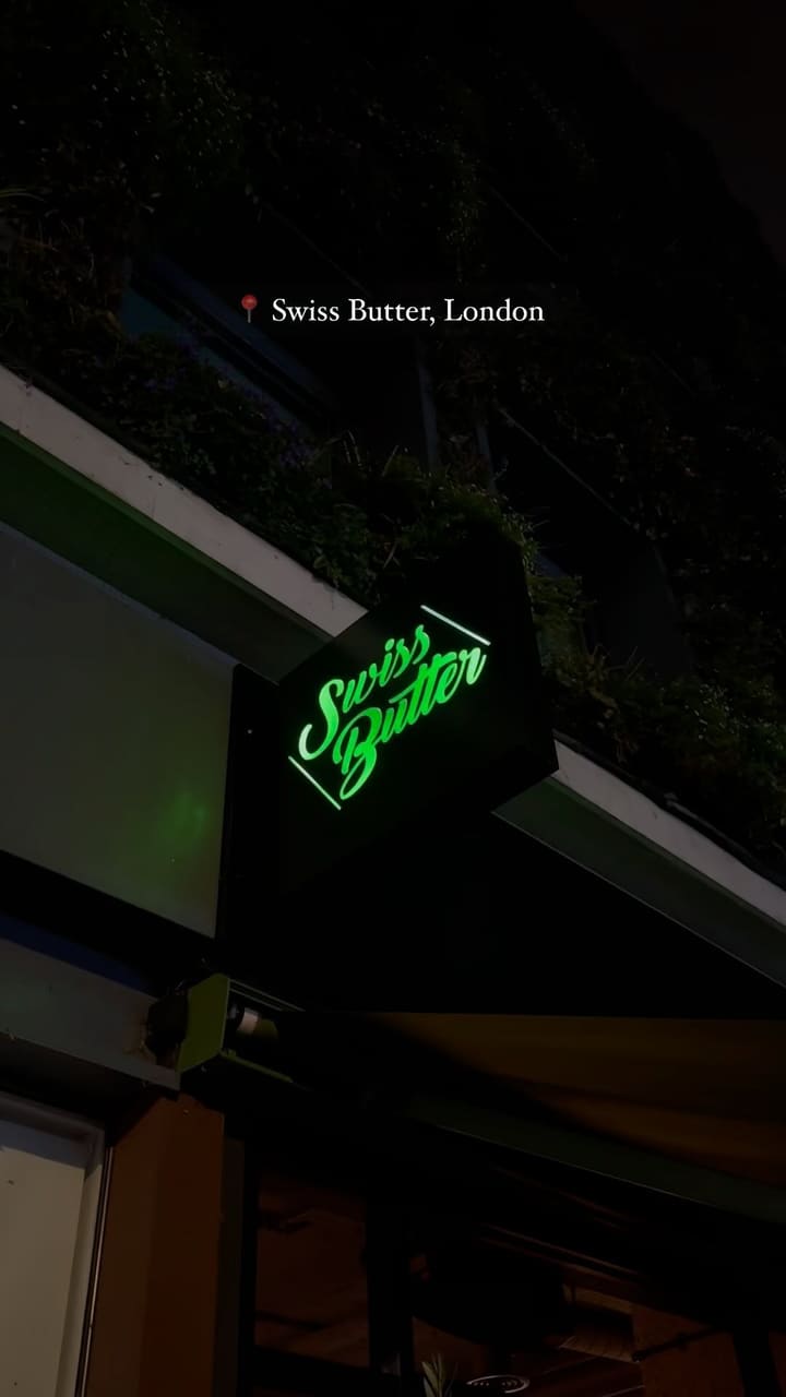 This video showcases Swiss Butter, a restaurant in London. It features the restaurant's interior, menu, and food items. The video highlights their three main options: steak, chicken, and salmon, all served with a secret sauce, fries, salad, and bread.  Two desserts are also showcased: Pain Perdu and Molten Chocolate. The video emphasizes the restaurant's ambiance and the deliciousness of its food.