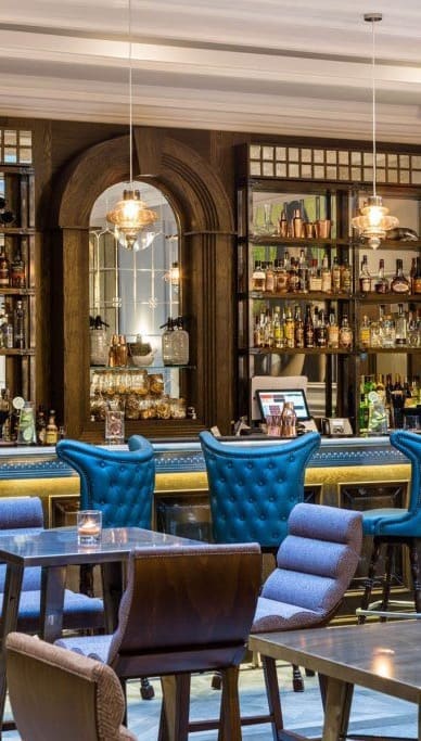This video provides a tour of the Courthouse Hotel Shoreditch in London, showcasing its various amenities, including the Jail House Bar, Judge & Jury Dining restaurant, spa, pool, cinema room, bowling alley, Upper 5th Rooftop bar, and a members' bar.  The video uses quick cuts to show various rooms and spaces within the hotel, giving a fast paced overview of the hotel’s offerings. The overall aesthetic of the hotel is modern and stylish.