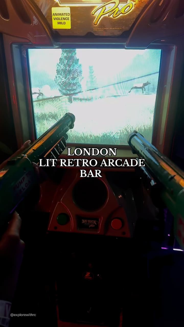 The video showcases NQ64 Soho, a retro arcade bar in London. It highlights the bar's atmosphere, various arcade games, and a selection of cocktails. The drinks shown include a flaming cocktail in a mason jar, another cocktail with ice and pineapple, and a blue-colored soda. The video also features a photo booth and VIP wristbands. The main focus is on the overall experience of the bar, emphasizing its fun, competitive, and social aspects.
