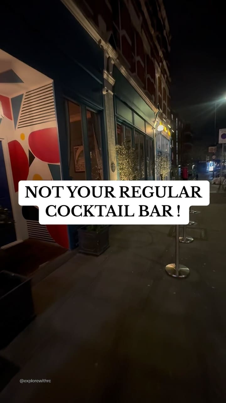 The video showcases The Little Blue Door, a cocktail bar in West London.  It presents various areas of the bar, including a living room-style area with projected movies, a games room, and a uniquely decorated laundry room.  The food shown includes steak with fries and a unique cocktail presentation is highlighted.  The bar's atmosphere and unique design elements are emphasized.