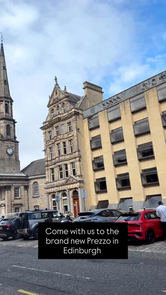 This video documents a family's visit to the new Prezzo Italian restaurant in Edinburgh. It begins with exterior shots of the street and the restaurant, followed by a tour of the stylish interior decor and artwork. The video highlights the family-friendly aspects, showing the kids' menu with 3D glasses and coloring activities. A variety of dishes are showcased, including starters like garlic bread with mozzarella and caramelized onions and pancetta mac & cheese bites. The main courses featured are several pizzas, such as pepperoni, a meat lovers pizza, a margherita, and a king prawn and burrata pizza. For dessert, the video shows a build-your-own sundae for the child, Nutella dough balls, and an affogato. The video also points out special offers like half-price cocktails and free desserts.