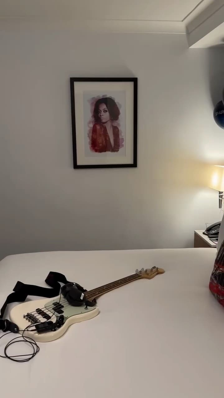 A video montage showcasing a birthday stay at The Cumberland Hotel in London. It begins with an exterior shot and moves inside to show the lounge, a buffet of appetizers, and the reception area. The video follows the creator into her room, which is decorated for her birthday with balloons and includes a bass guitar and record player. It highlights hotel amenities like the modern bathroom, closet, gym, and live music venue (SOUND London). The video also features the breakfast buffet, showing a chef making an omelette, pastries, and other options. The creator is seen enjoying the stay, relaxing in bed with a drink. The video concludes with final shots of the hotel's stylish interior and exterior.