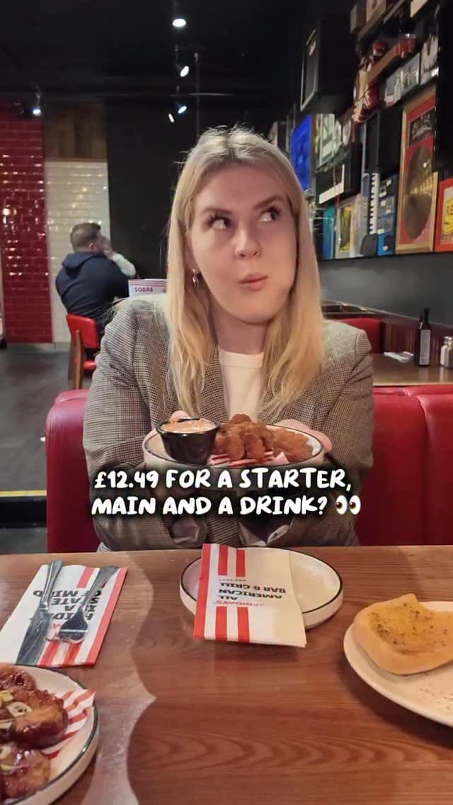 A promotional video featuring two creators visiting TGI Fridays to highlight their 'Everyday Trio' meal deal. The video showcases the menu options, the food served, and the casual dining atmosphere of the restaurant.