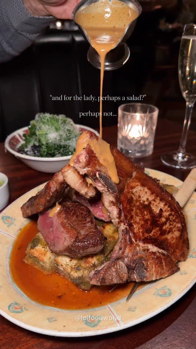 A short, high-quality video showcasing the 'All In' meat platter at Blacklock, featuring close-up shots of the meat being drizzled with gravy and the accompanying sides.
