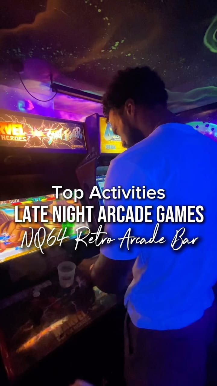 The video showcases NQ64, an arcade bar in London. It features various retro arcade games, cocktails, and a vibrant atmosphere. The video highlights the bar's ambiance, game selection (including Guitar Hero, Tetris, Pac-Man, Mortal Combat, shooting games, and driving games), and cocktail menu. It also mentions the bar's late hours (open until 3 AM) and its Soho and Shoreditch locations.