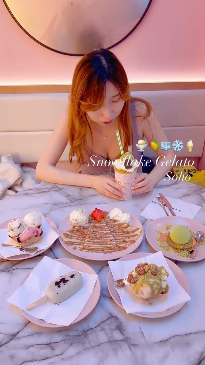 The video showcases Snowflake Gelato in Soho, London. It features various gelato flavors, including pistachio and hazelnut, and a Lotus Biscoff crepe.  The presentation is visually appealing, with pink plates and a clean aesthetic. Dietary information isn't explicitly provided, but the gelato uses organic Jersey milk. The main focus is on presenting the delicious-looking desserts.