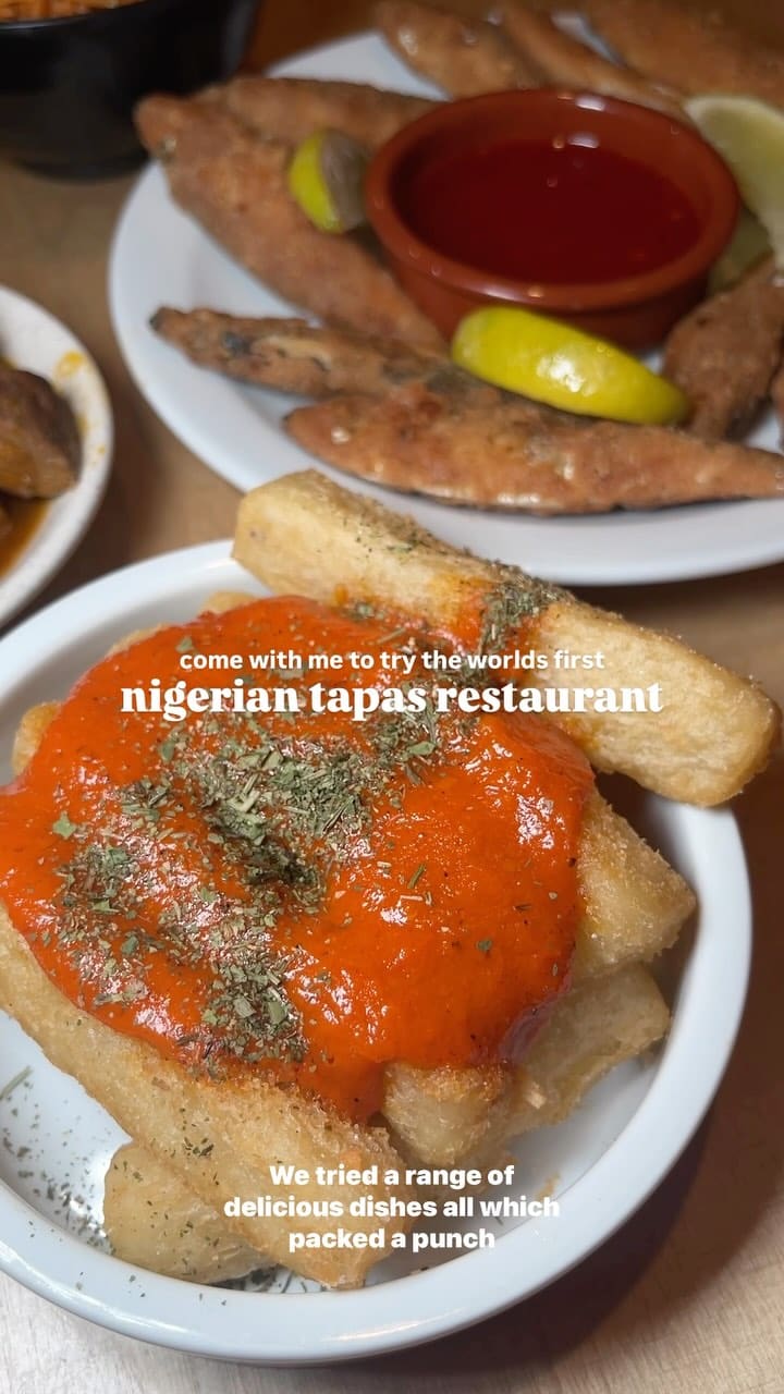 The video showcases Chuku's Nigerian tapas restaurant in Tottenham, London. It features various dishes, including kuli kuli wings, spicy fried whitebait, cassava fries with a spicy sauce, suya prawns, and a plantain waffle with ice cream and blueberries. The drinks shown include a Chapman punch. The video highlights the restaurant's ambiance and food presentation, emphasizing the bold flavors and generous portions.