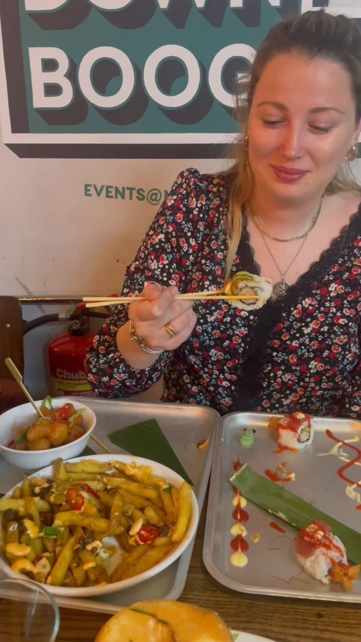 This video showcases Inamo restaurant at Market Halls in Oxford Street, London.  The video highlights various dishes including sushi (Dragon Roll, Samurai Roll), duck fries, karaage burger, bang bang cauliflower, and crispy teriyaki duck pancakes.  The presentation is visually appealing, with careful plating of the sushi and a focus on close-up shots of the food.  Dietary information is not explicitly provided.  The main focus is a meal showcase.