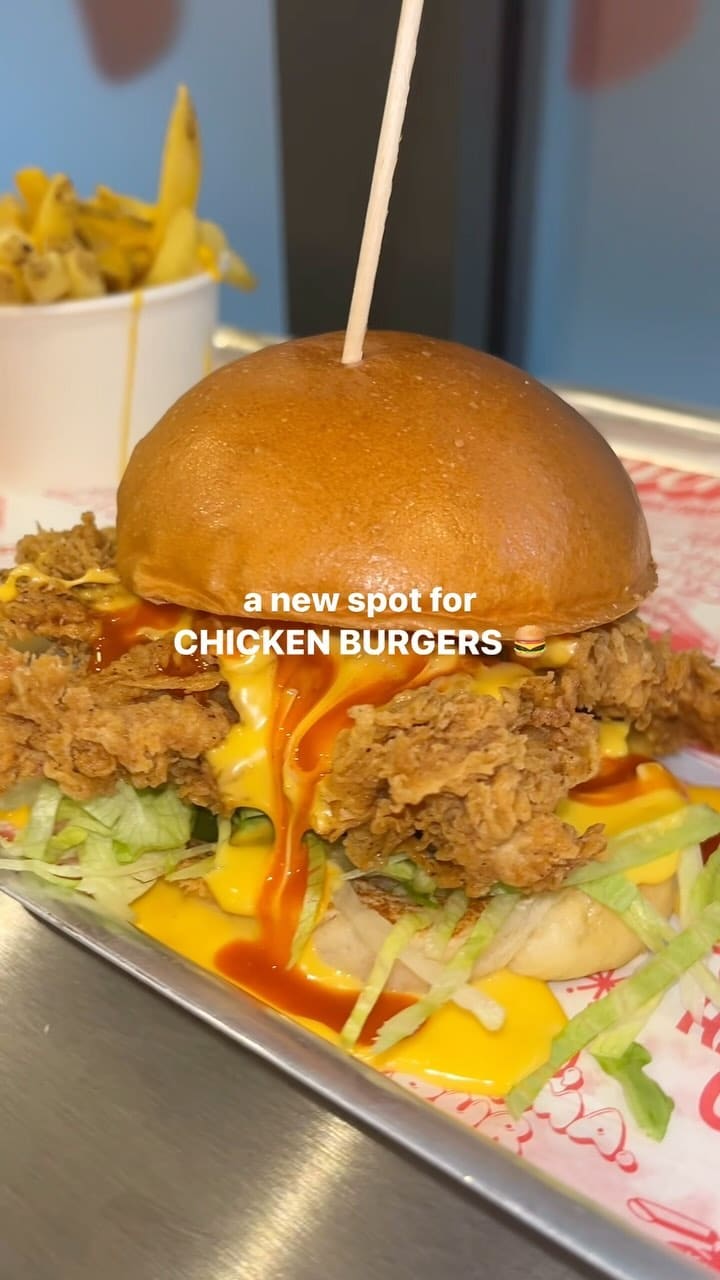 The video showcases Butchies Fried Chicken, a new restaurant in London Bridge.  It features various menu items, including buttermilk fried chicken sandwiches, loaded fries, and chicken tenders, shown in close-up shots.  The food is presented in a visually appealing manner using various angles and lighting. The video also highlights the restaurant's interior and signage. Halal options are mentioned. The main focus is on showcasing the food and creating an appetizing visual presentation.